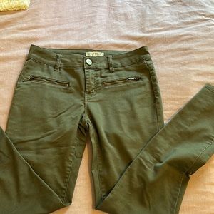 Distressed army green jeans